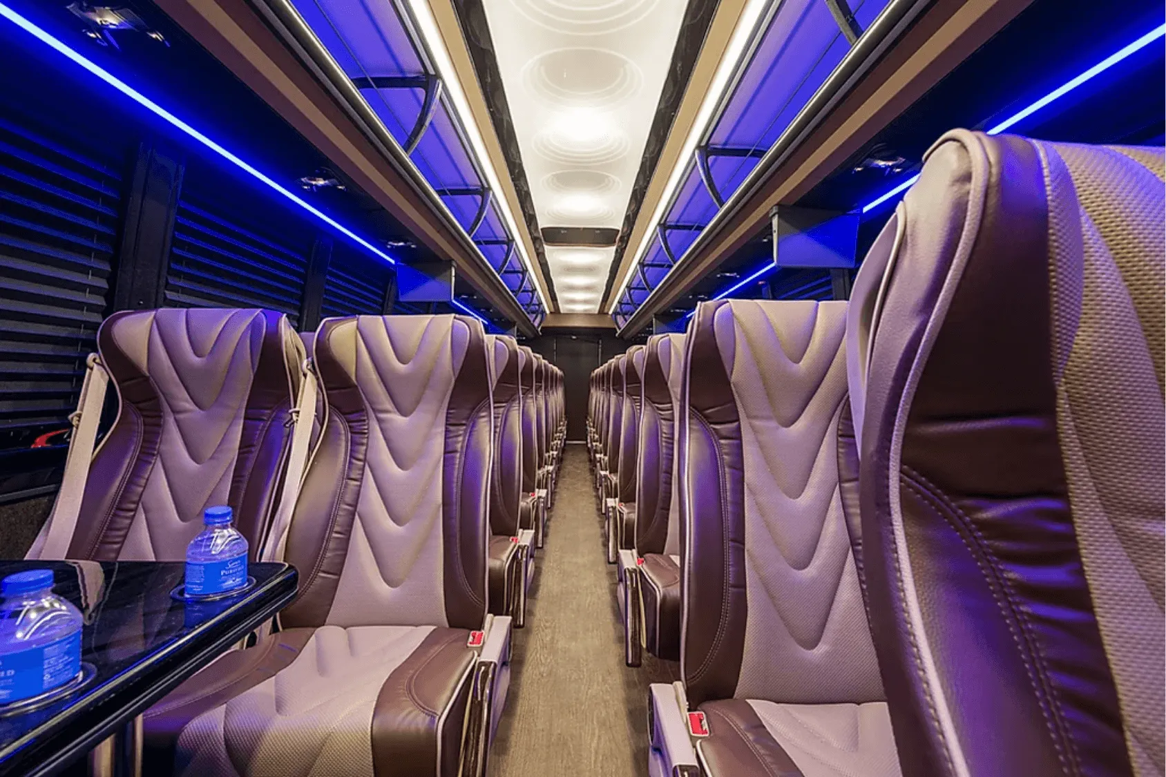 Rows of reclining seats inside a Chicago Super Coach bus